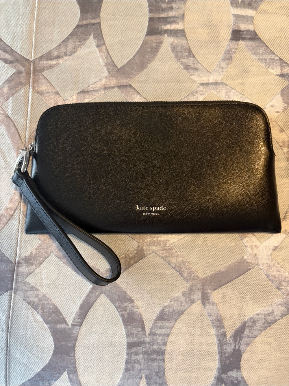 kate spade Black Leather Zip-Top Toiletry Halo Wristlet. New. Never used.